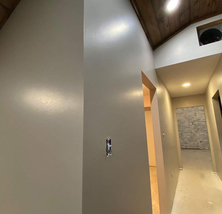 Freshly painted interior walls under a wood ceiling