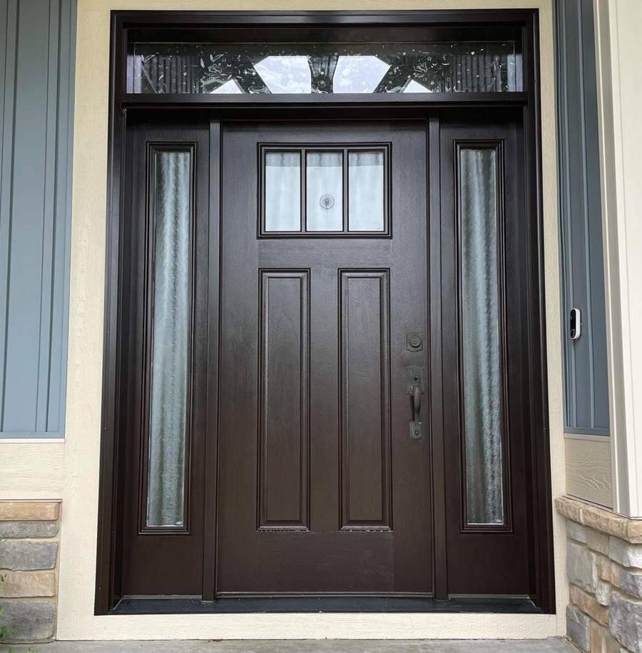 Front entry door with sidelights and transom in a dark finish