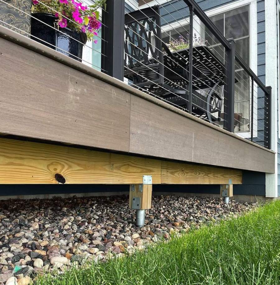 A new beam and posts under a deck