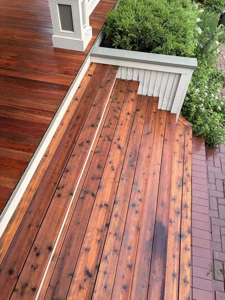 The stained steps and porch floor seen from above