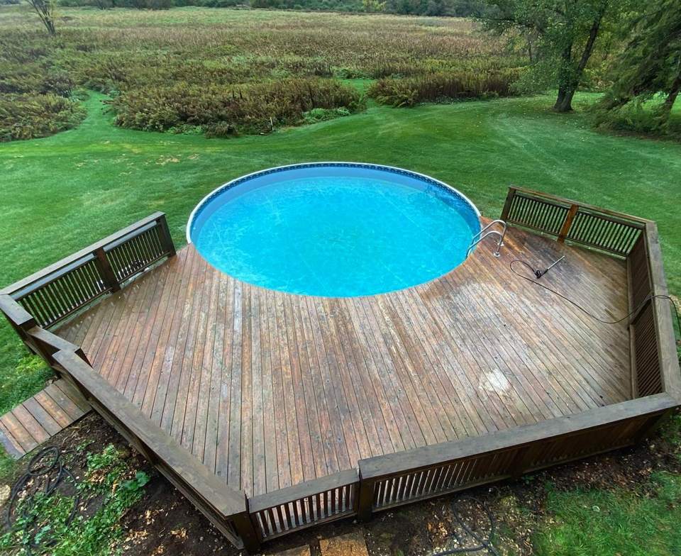 Weathered gray-brown pool deck before refinishing